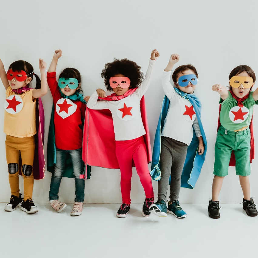 Group of Diverse Children Playing superhero on the white wall background. Superhero concept. Happy Time.